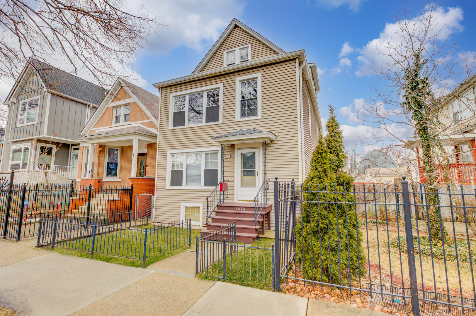 4018 North Whipple Street Chicago, IL 60618 - Photo 3 of 25 a front view of a house with a yard