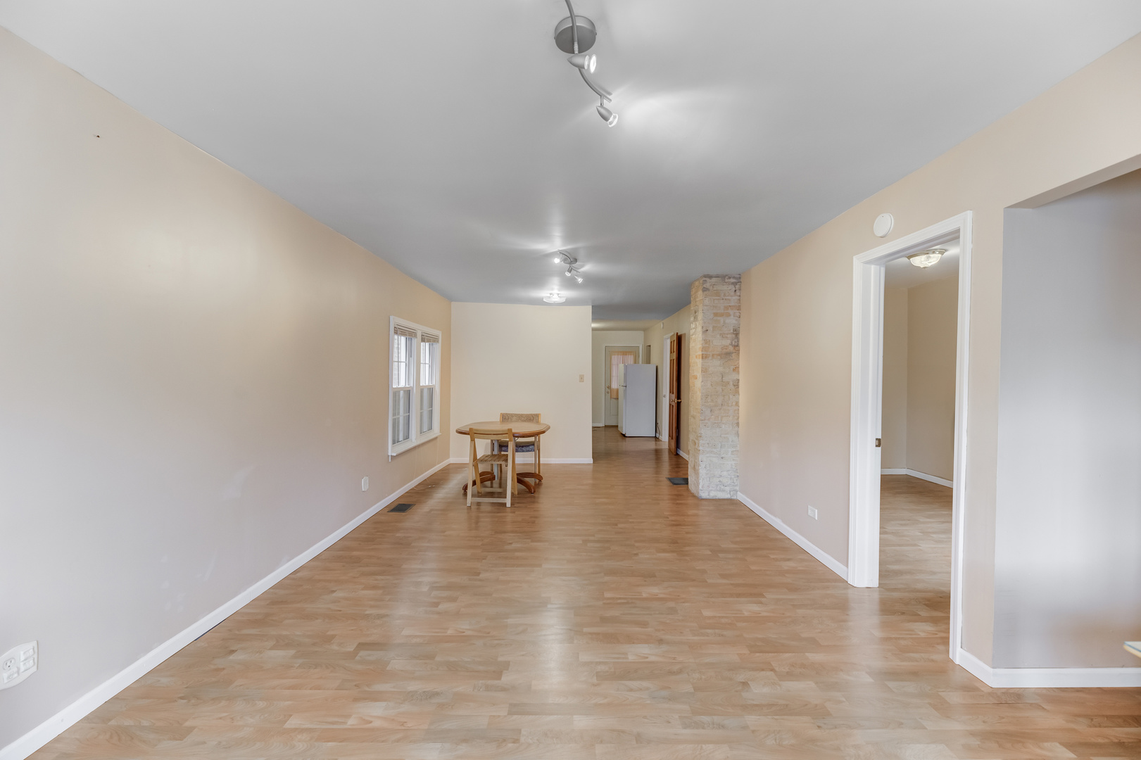 4018 North Whipple Street Chicago, IL 60618 - Photo 4 of 25 a view of an empty room with window and wooden floor
