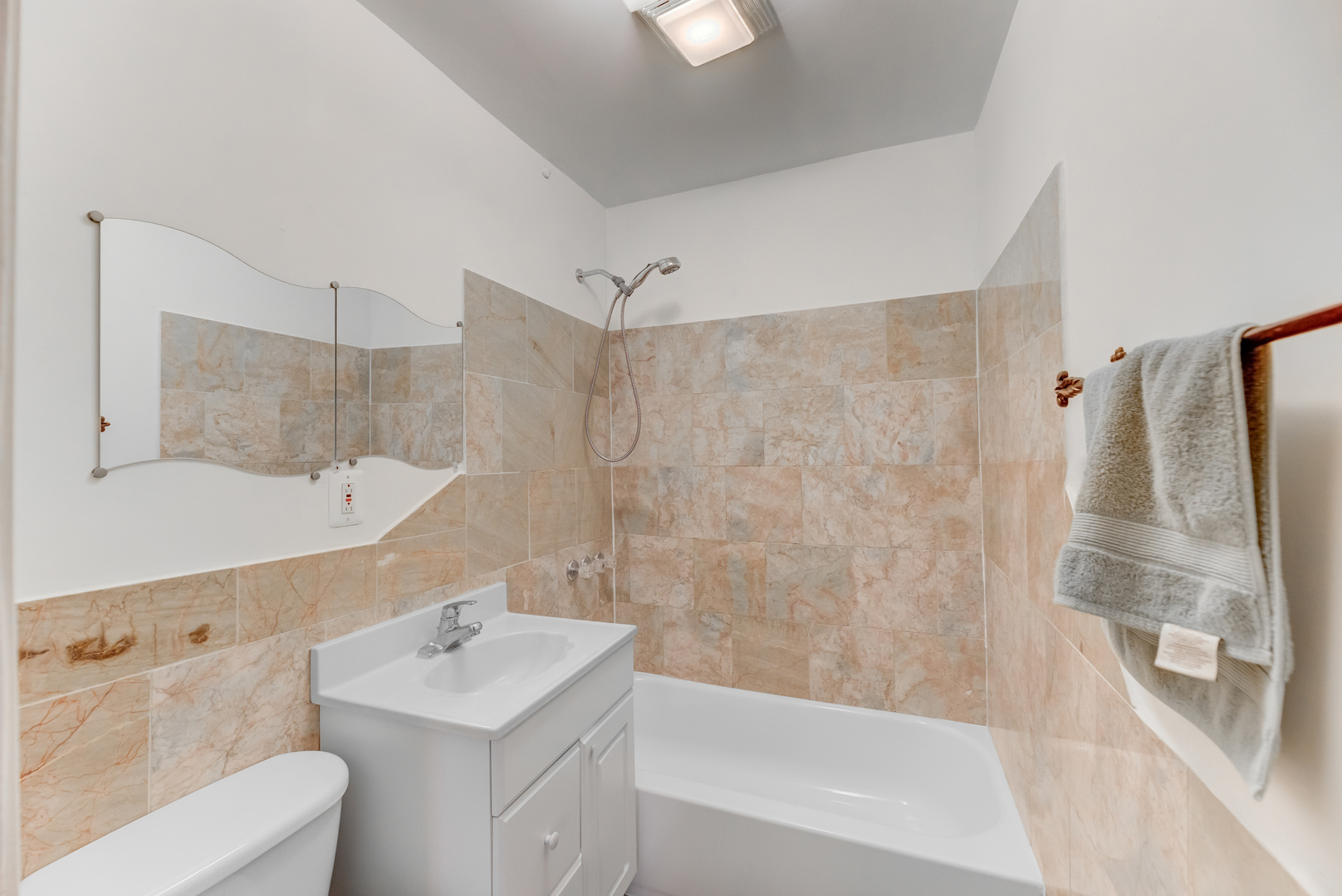 4018 North Whipple Street Chicago, IL 60618 - Photo 6 of 25 a bathroom with a sink toilet and shower