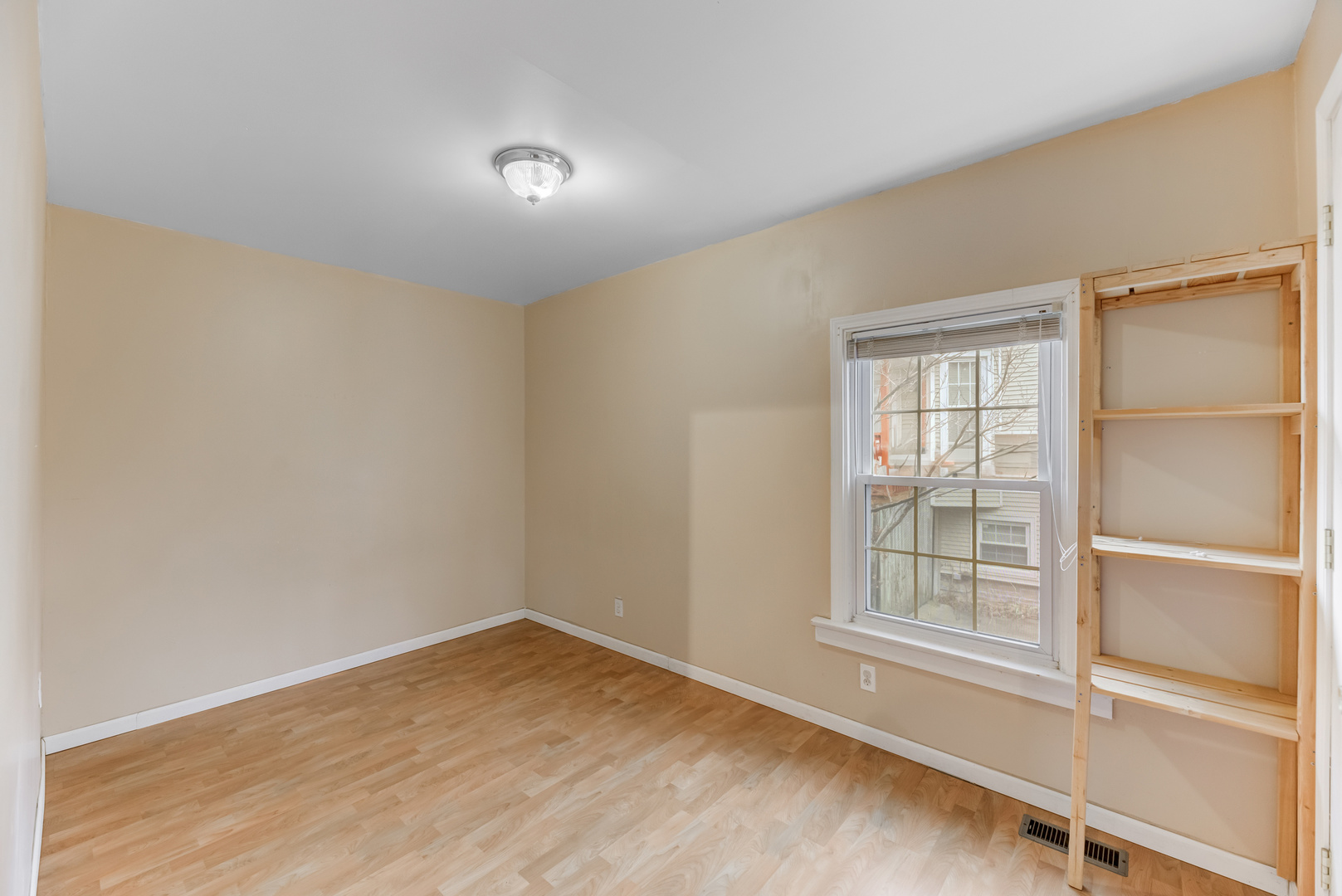 4018 North Whipple Street Chicago, IL 60618 - Photo 7 of 25 an empty room with a window
