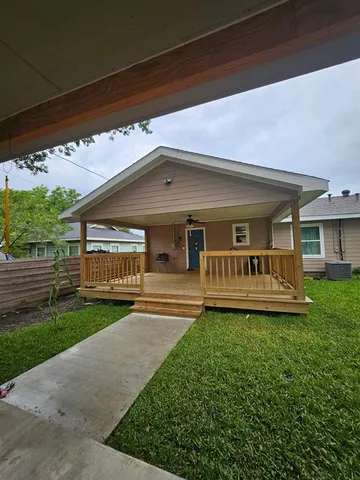 a front view of a house with a yard table and chairs