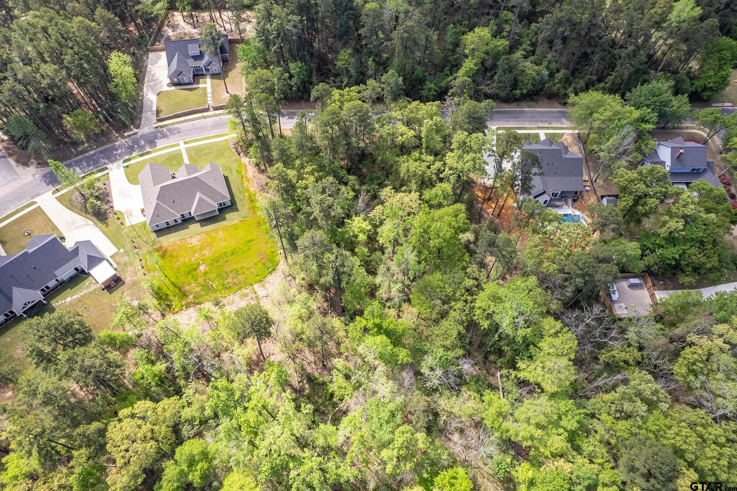 4028 Hanover Place Tyler, TX 75701 - Photo 15 of 16 an aerial view of residential house with outdoor space and swimming pool
