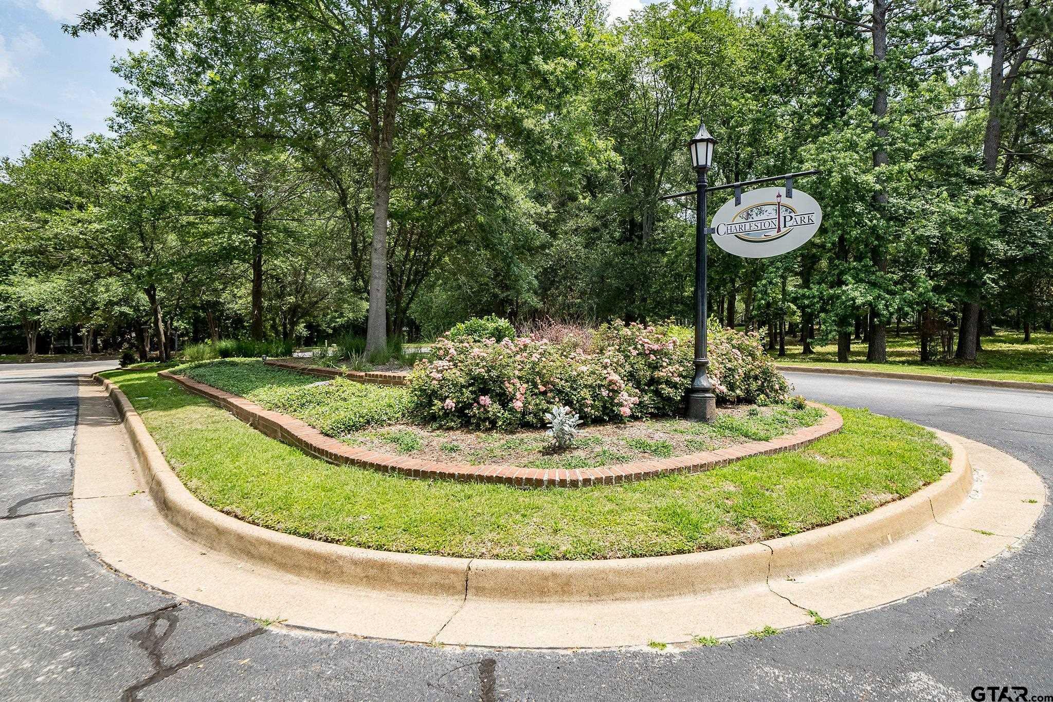 4028 Hanover Place Tyler, TX 75701 - Photo 2 of 16 a view of a swimming pool with a yard
