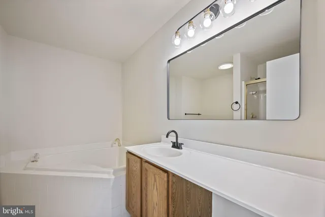 a view of an empty room and closet area