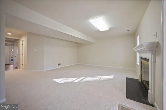 a front view of a building with a yard