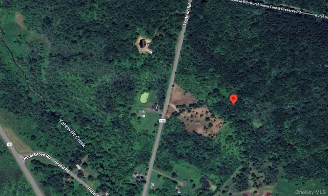 a aerial view of a house with a yard