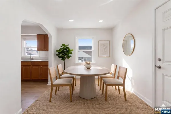 a dining room with furniture and window