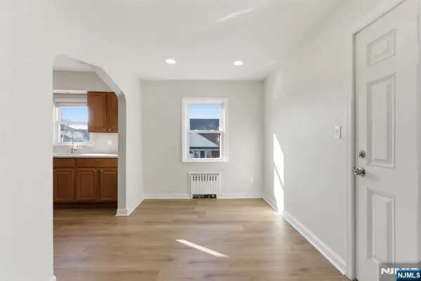a view of a kitchen with a sink cabinets and a window