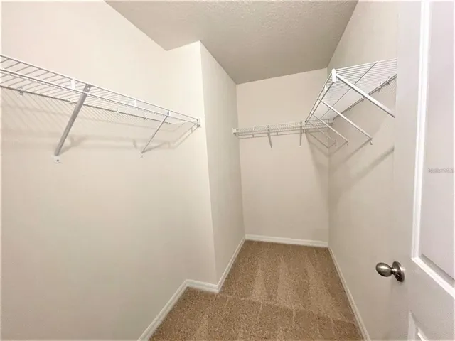 a view of a livingroom with storage and utility