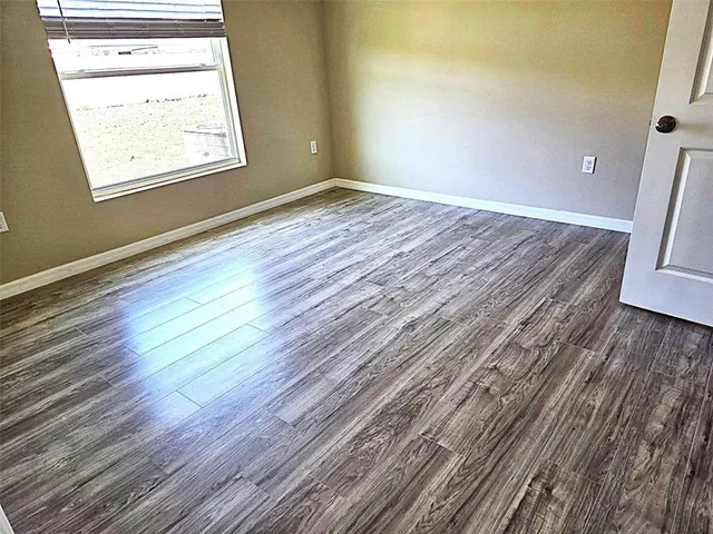 a view of a backyard of the house