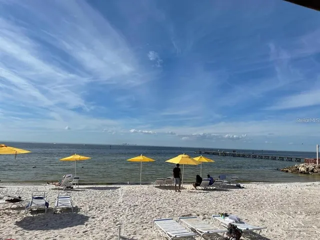 a view of a chairs and table in the patio