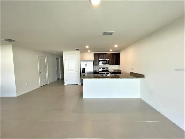 a view of a kitchen with a sink