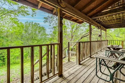 a view of a balcony with chairs