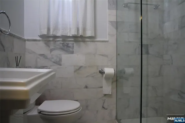 a kitchen with stainless steel appliances granite countertop a stove and a microwave