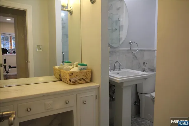 a kitchen with stainless steel appliances granite countertop a stove microwave and sink