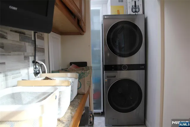 a view of a hallway with a wooden floor and a sink
