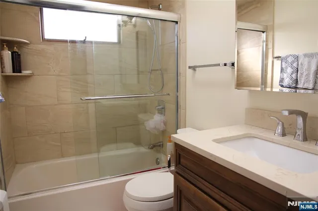 a view of a patio with a table and chairs and potted plants