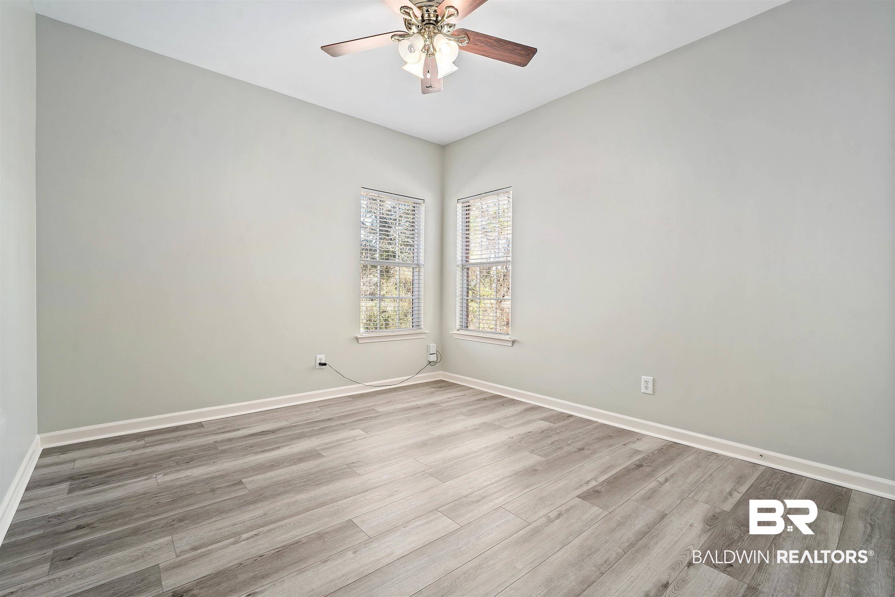 615 Summerlake Place Mobile, AL 36608 - Photo 28 of 35 Empty room with light wood finished floors and a ceiling fan