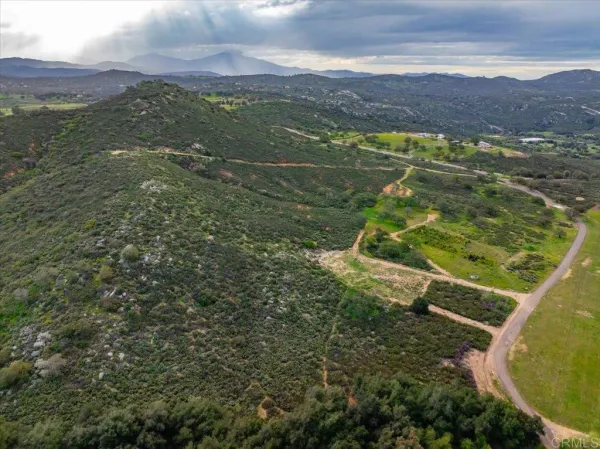 a view of a field with an ocean