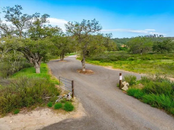 a view of a street with a yard