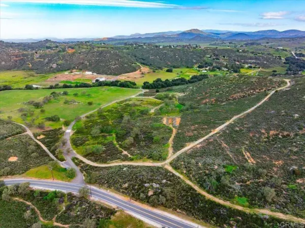 a view of a city with mountains in the background