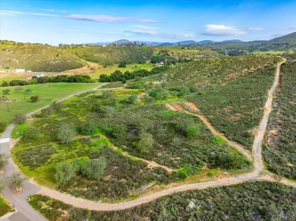a view of a lake with a yard