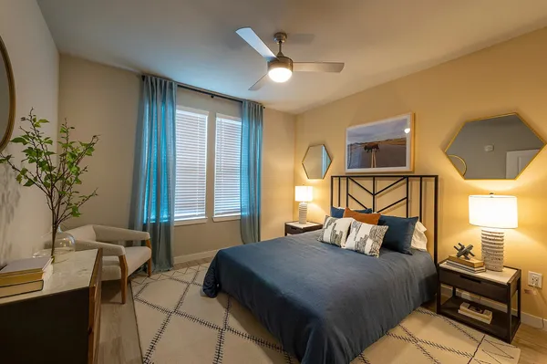 a bedroom with a bed and window