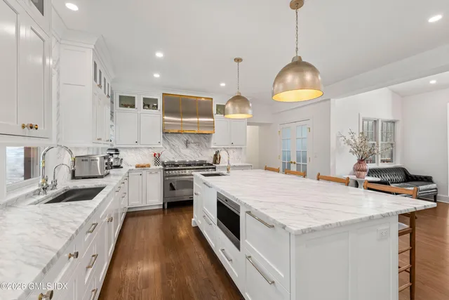 a spacious bedroom with a bed and a couch