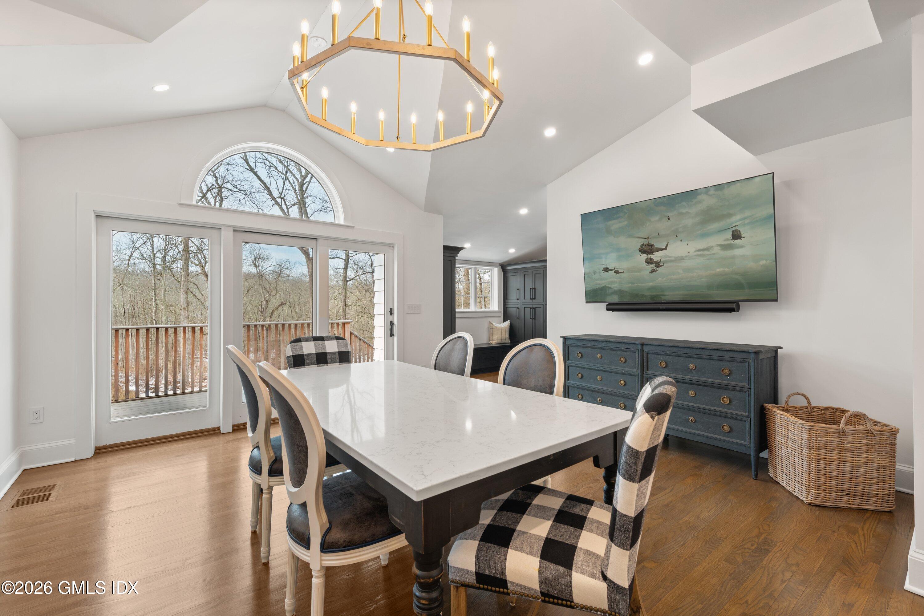530 Round Hill Road Greenwich, CT 06831 - Photo 14 of 63 a view of a dining room with furniture wooden floor and chandelier