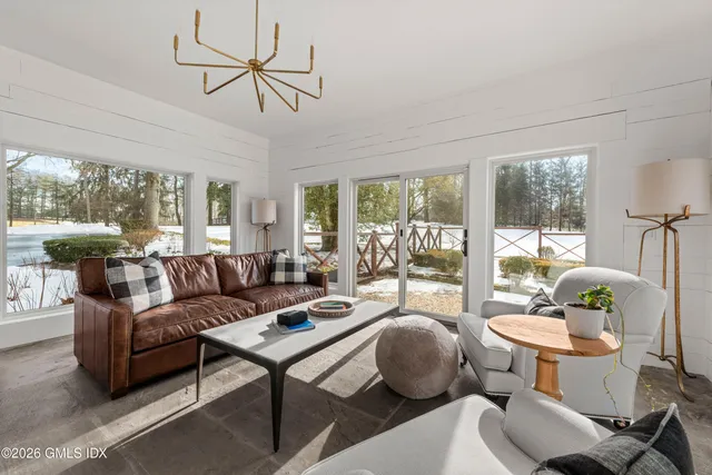 a bathroom with a toilet a sink and a mirror