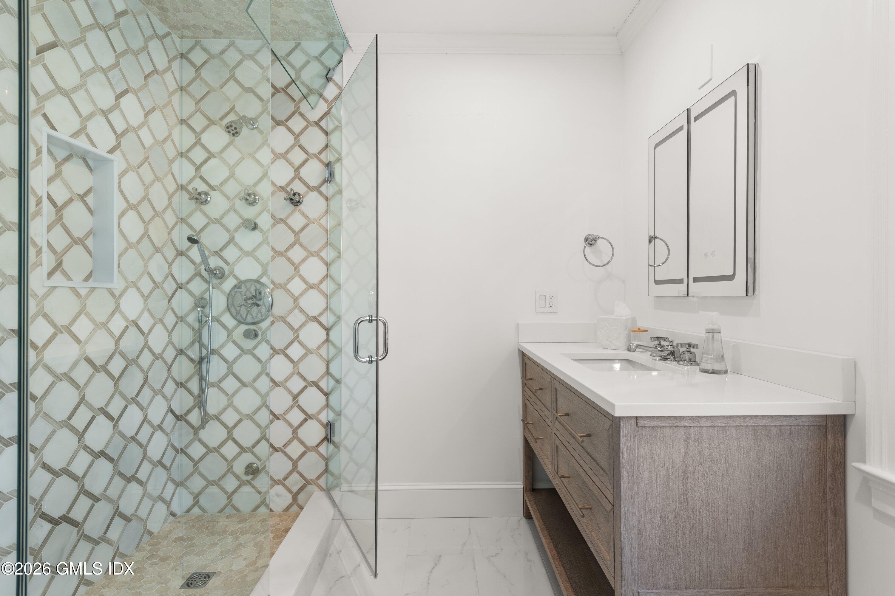 530 Round Hill Road Greenwich, CT 06831 - Photo 33 of 63 a bathroom with a sink a vanity and a mirror