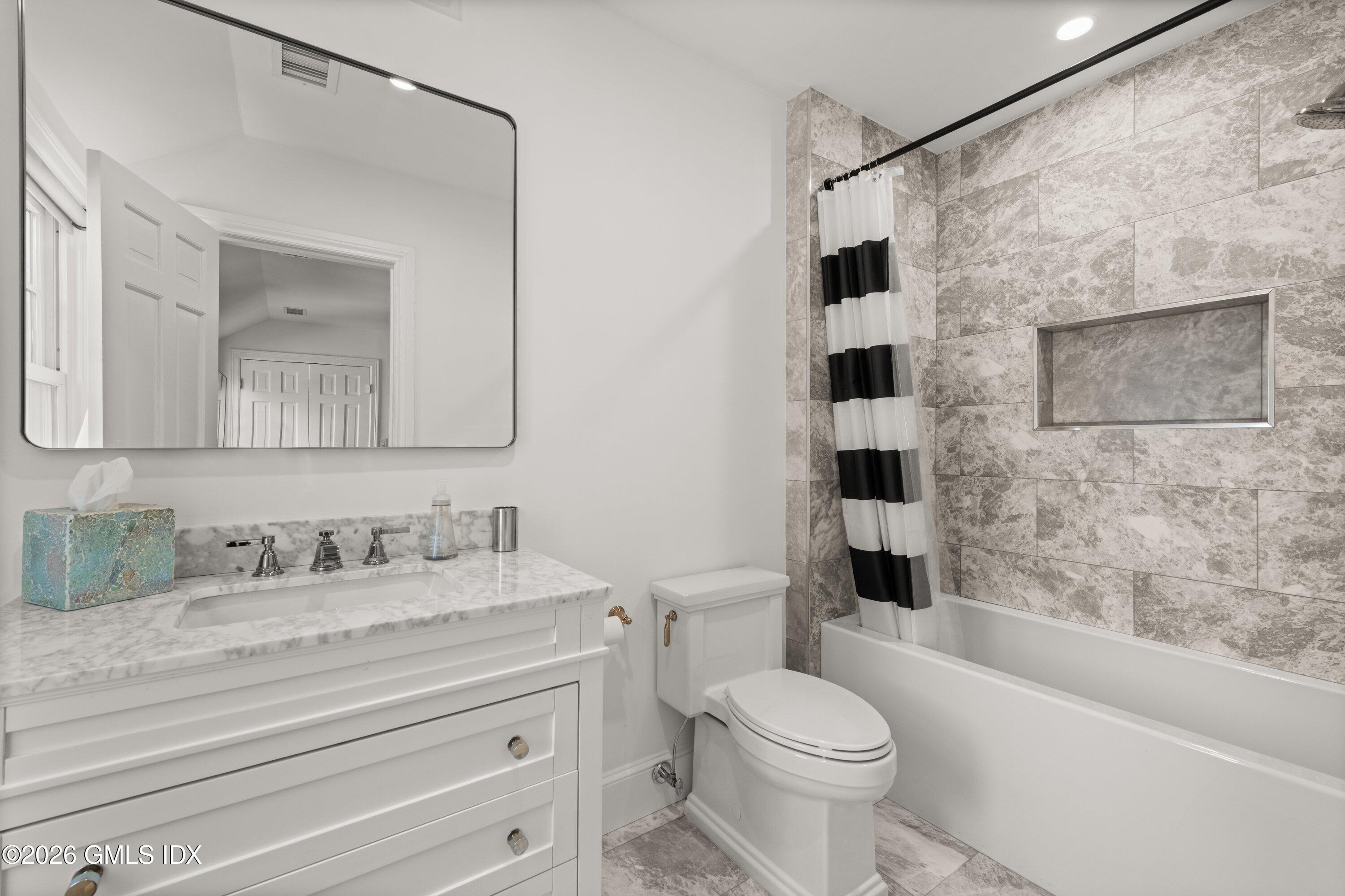 530 Round Hill Road Greenwich, CT 06831 - Photo 38 of 63 a bathroom with a granite countertop toilet sink and shower