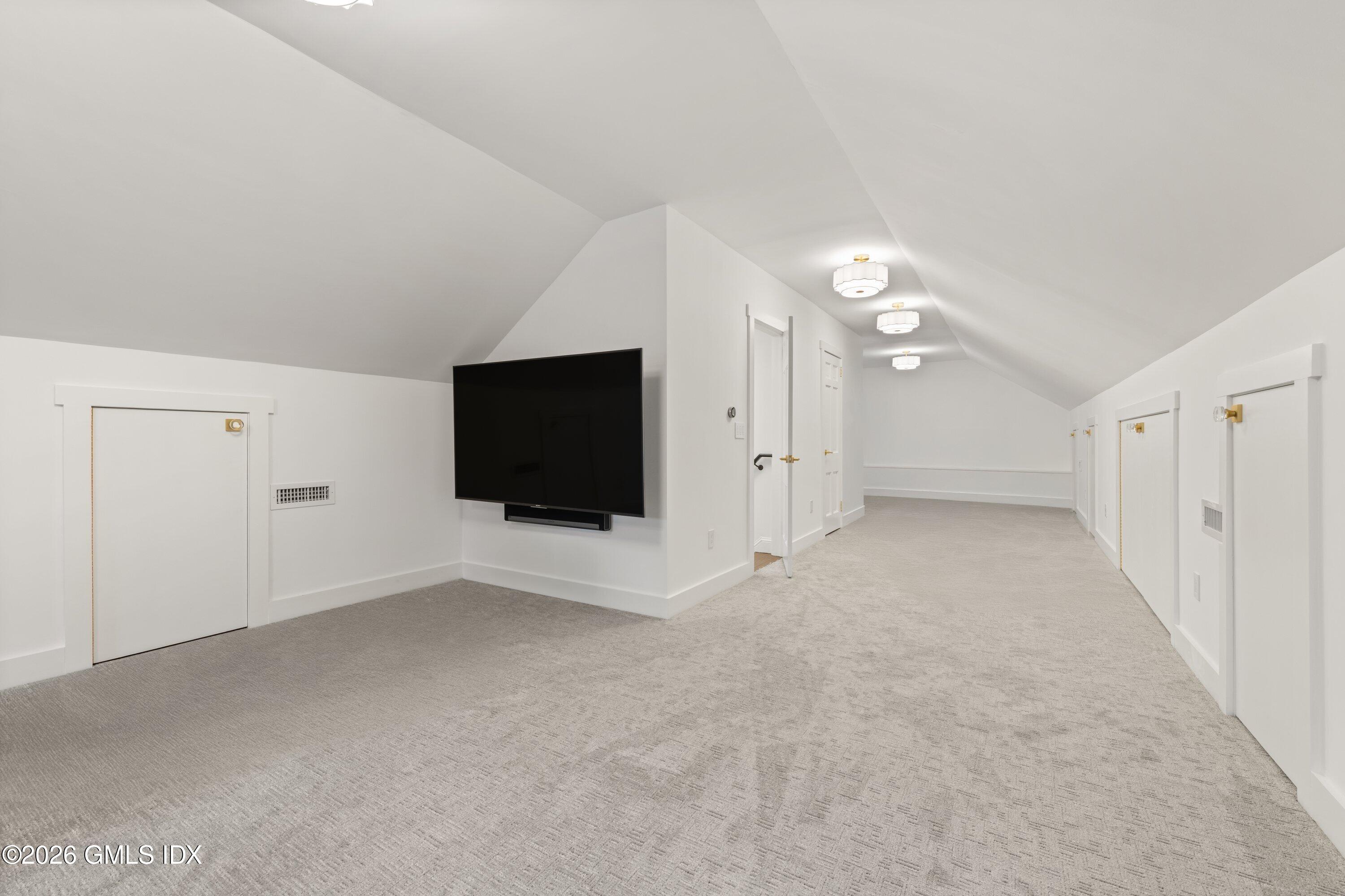 530 Round Hill Road Greenwich, CT 06831 - Photo 46 of 63 a view of an empty room with a flat screen tv