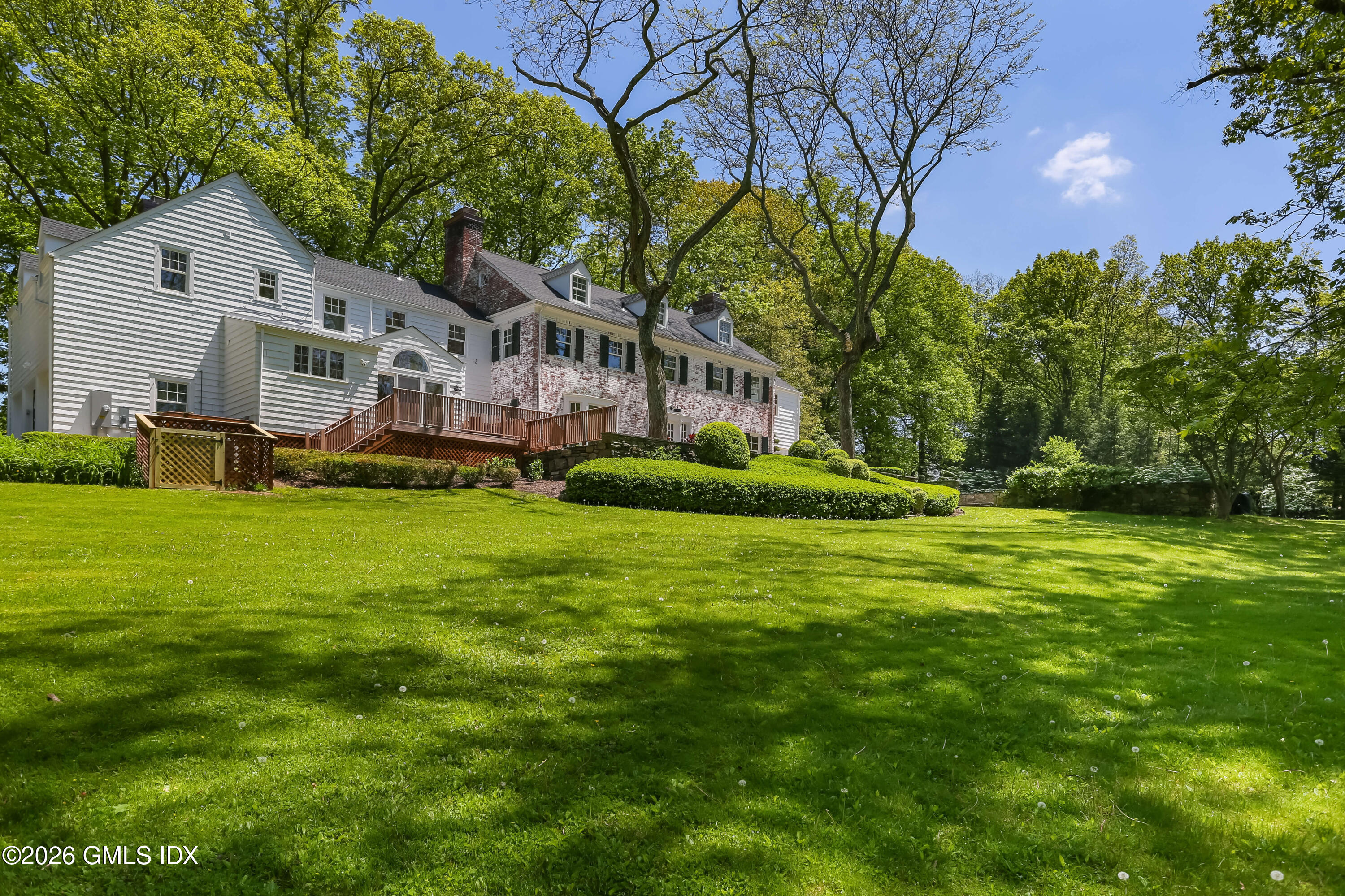 530 Round Hill Road Greenwich, CT 06831 - Photo 59 of 63 a front view of house with yard and green space