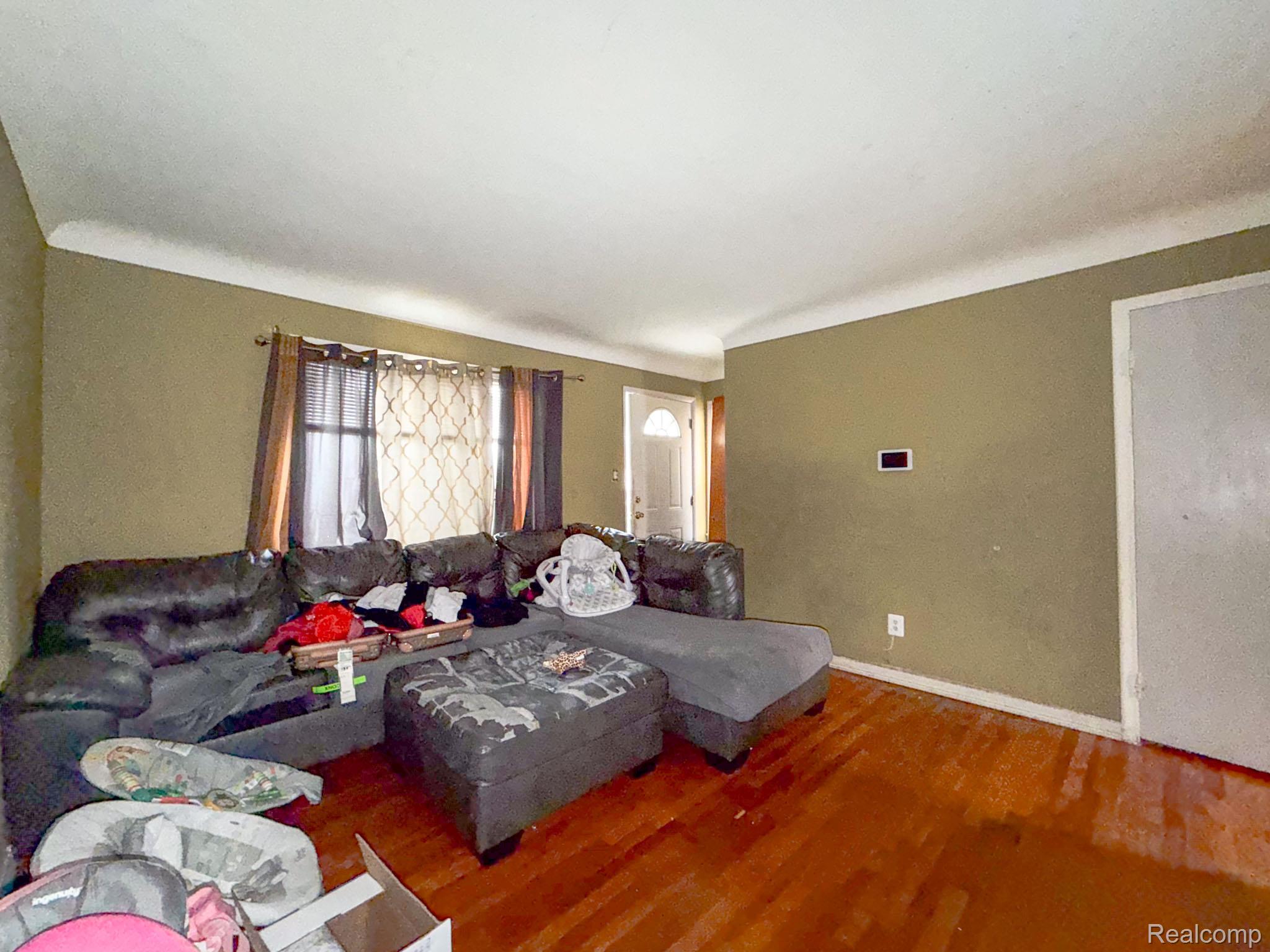 24811 Valley Avenue Eastpointe, MI 48021 - Photo 4 of 22 Living area with wood finished floors and baseboards