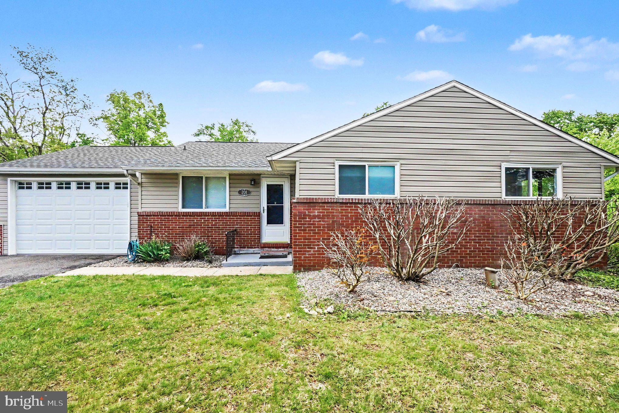 201 Mountain Road Fallston, MD 21047 - Photo 1 of 35 a front view of a house with a yard and garage