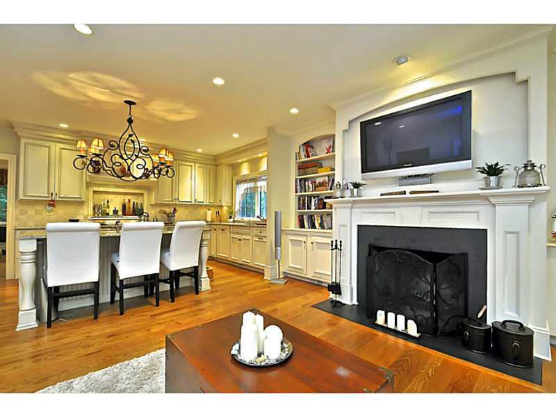 19 Terrace Avenue Riverside, CT 06878 - Photo 12 of 25 a living room with furniture a flat screen tv and a fireplace