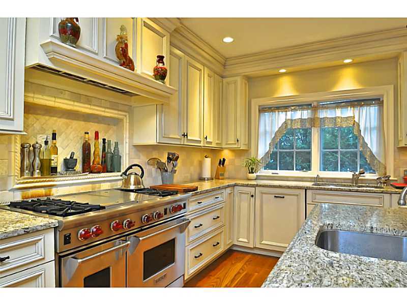 19 Terrace Avenue Riverside, CT 06878 - Photo 9 of 25 a kitchen with a stove a sink and a cabinets