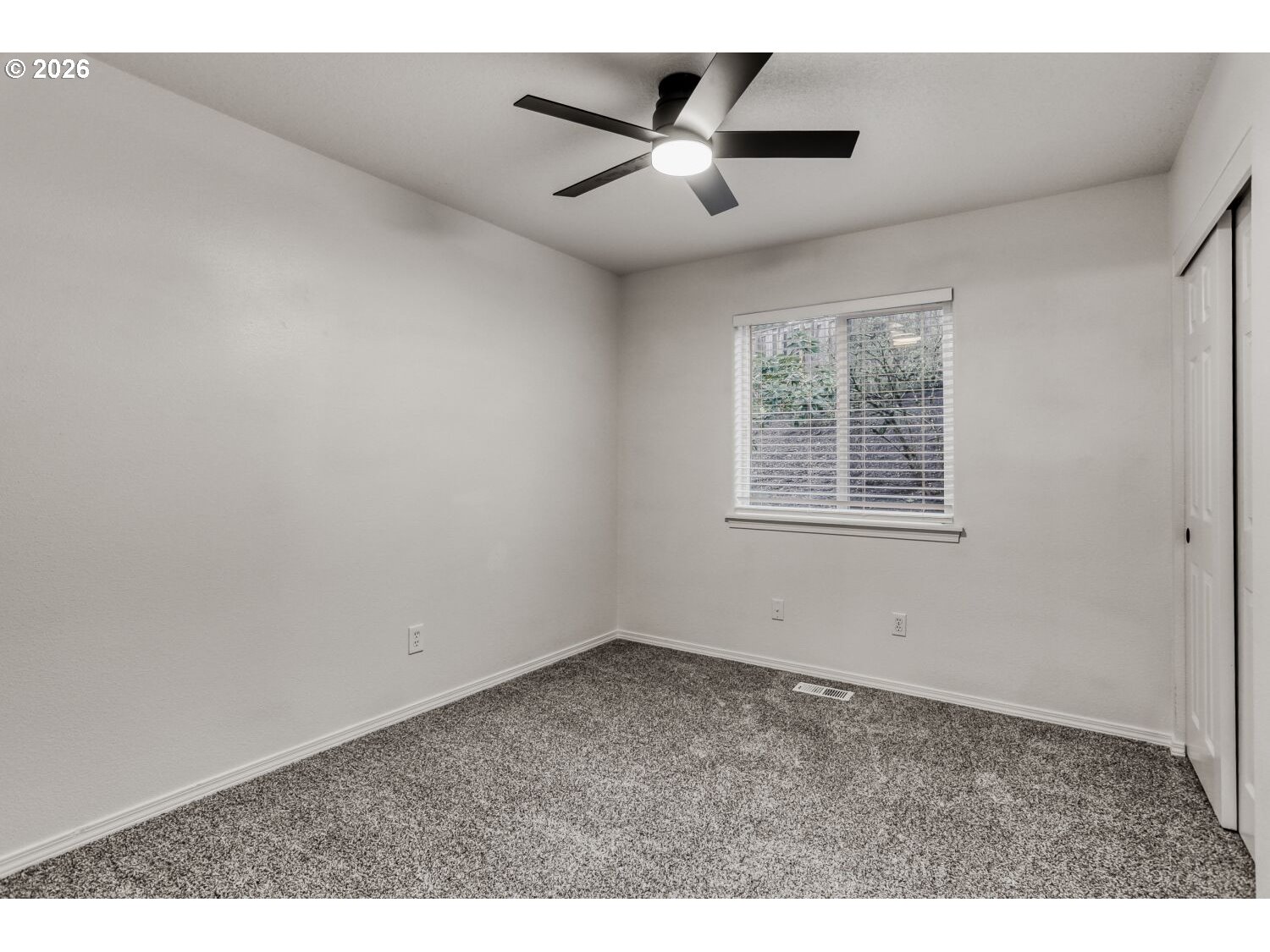 7642 Southwest 205th Terrace Beaverton, OR 97007 - Photo 25 of 28 a view of an empty room with a window
