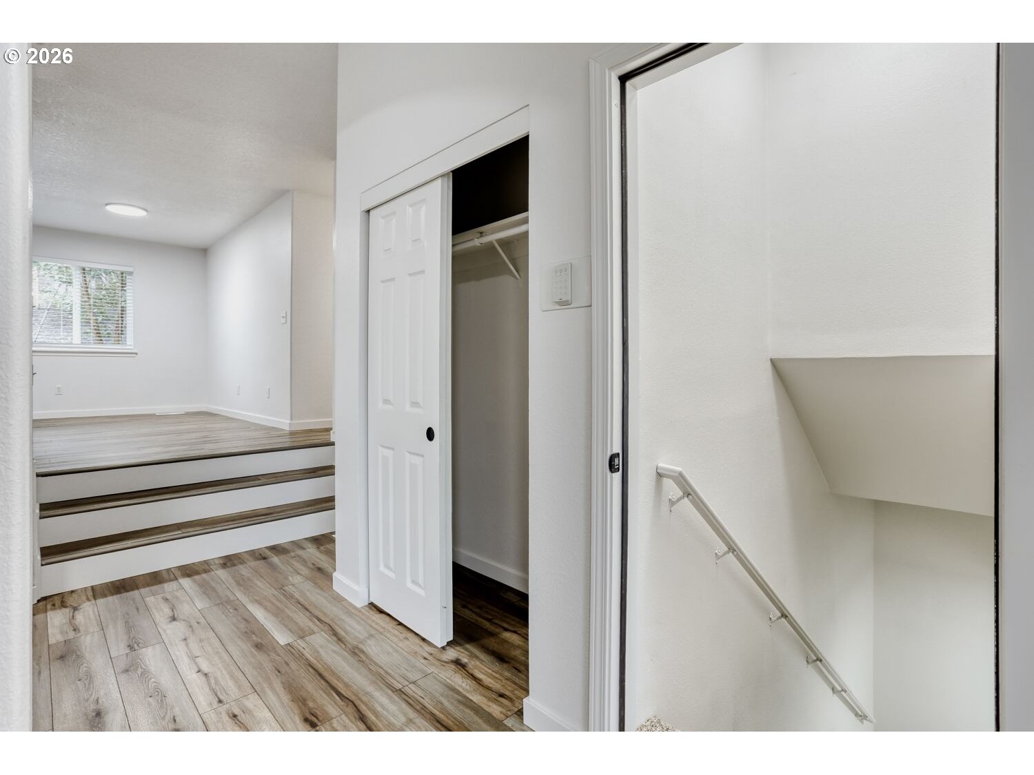 7642 Southwest 205th Terrace Beaverton, OR 97007 - Photo 5 of 28 a view of wooden floor and windows in a room