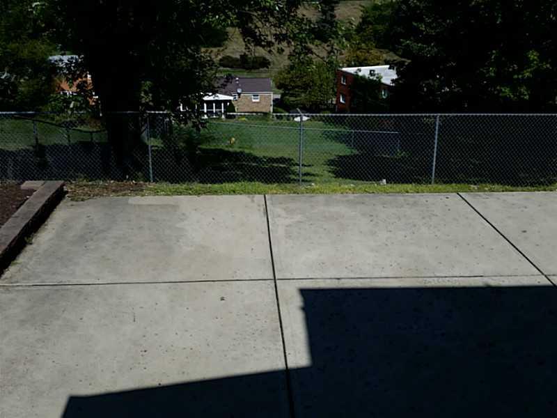 9 Highbury Road Cheswick, PA 15024 - Photo 19 of 19 Exterior Back. Fenced in backyard and huge paved area, nice lot