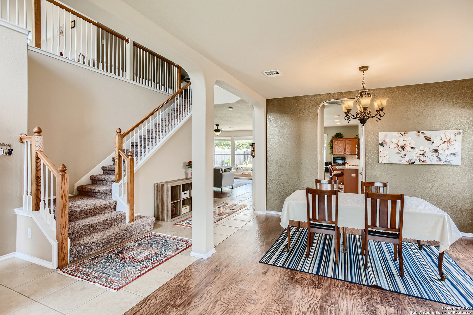 8311 Grapevine Pass San Antonio, TX 78255 - Photo 1 of 1 a view of entryway dining room and hall with wooden floor