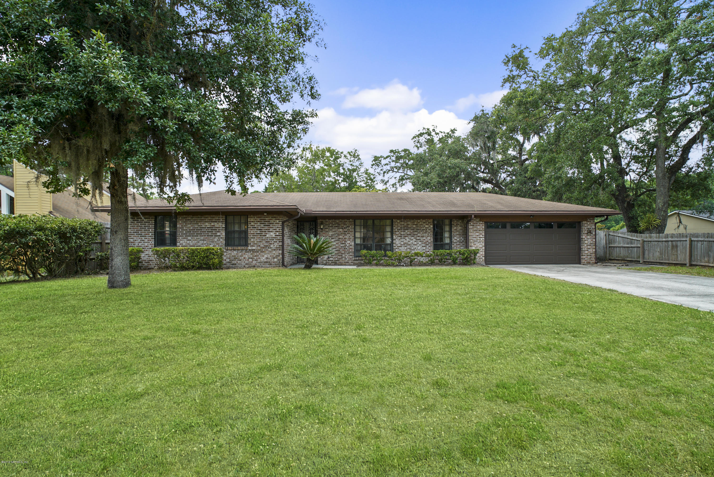 5353 Hickson Road Jacksonville, FL 32207 - Photo 1 of 18 a front view of a house with a garden