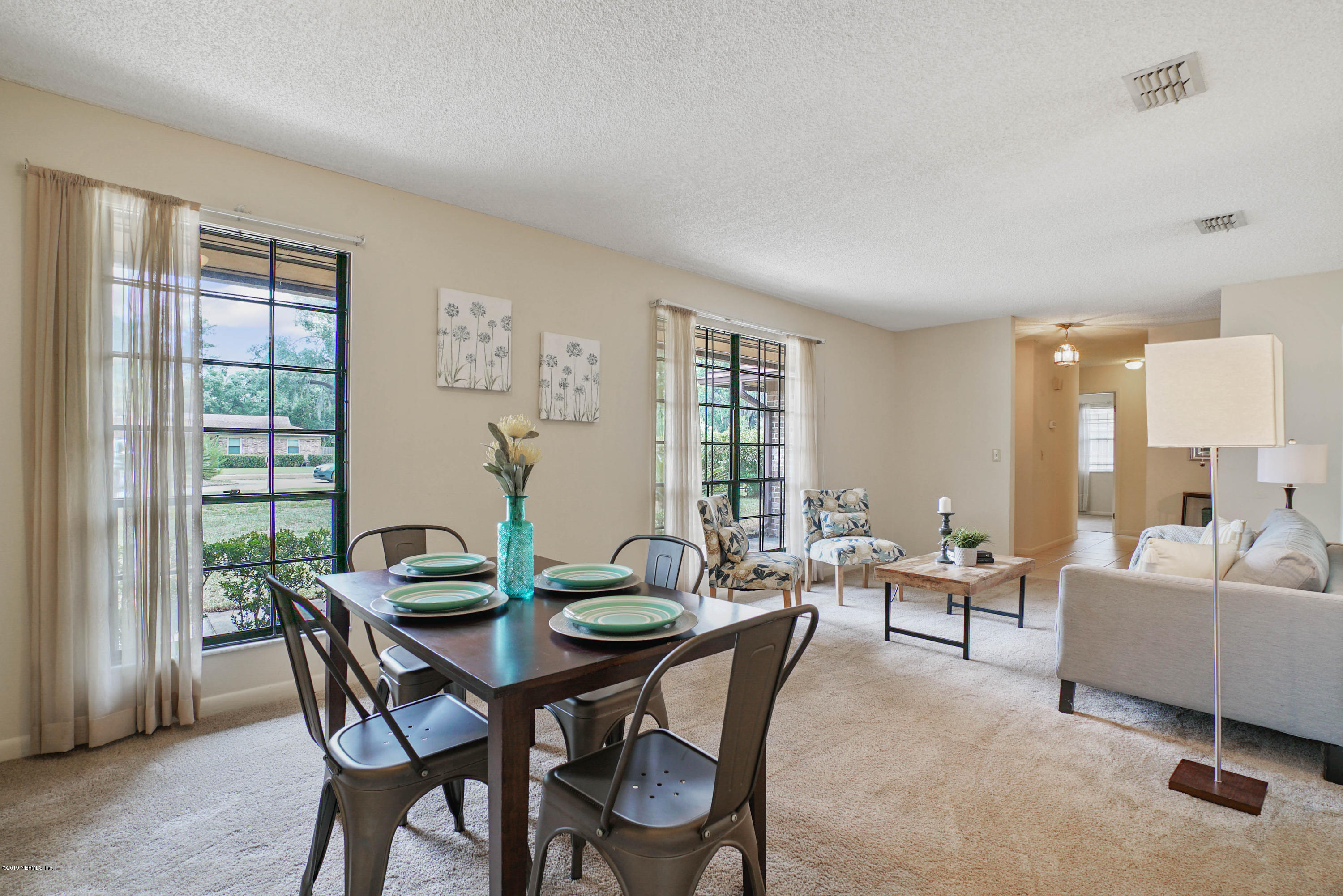 5353 Hickson Road Jacksonville, FL 32207 - Photo 3 of 18 a view of a dining room with furniture and wooden floor
