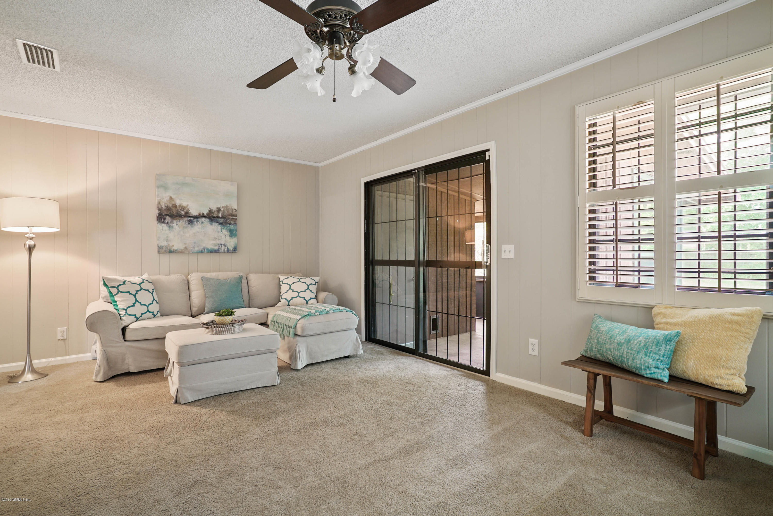 5353 Hickson Road Jacksonville, FL 32207 - Photo 7 of 18 a living room with furniture and a window