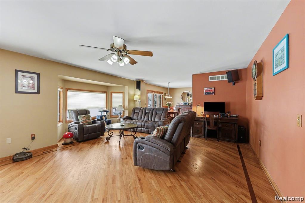 7277 Cardinal Road Algonac, MI 48001 - Photo 16 of 36 Living area with ceiling fan and light wood finished floors