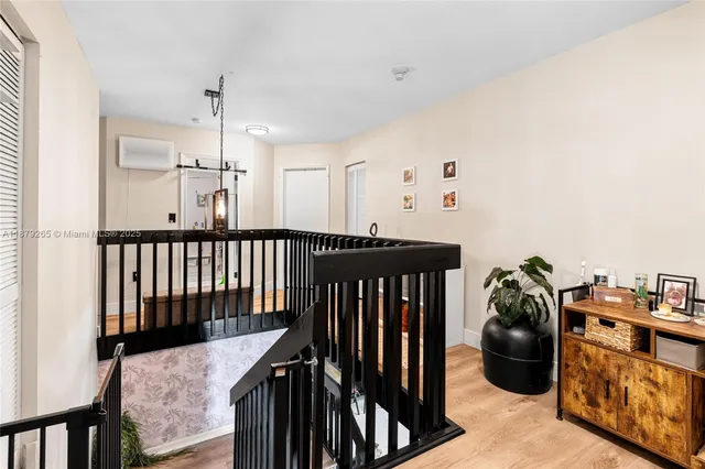 a hallway with a white stove a washer and dryer