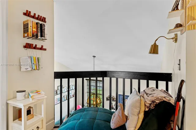 a bedroom with furniture and a window