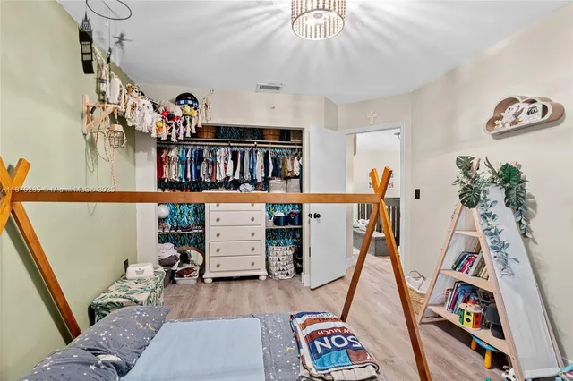 a view of a room with furniture and closet