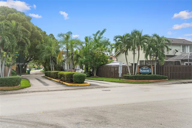 a house with palm tree in front of it